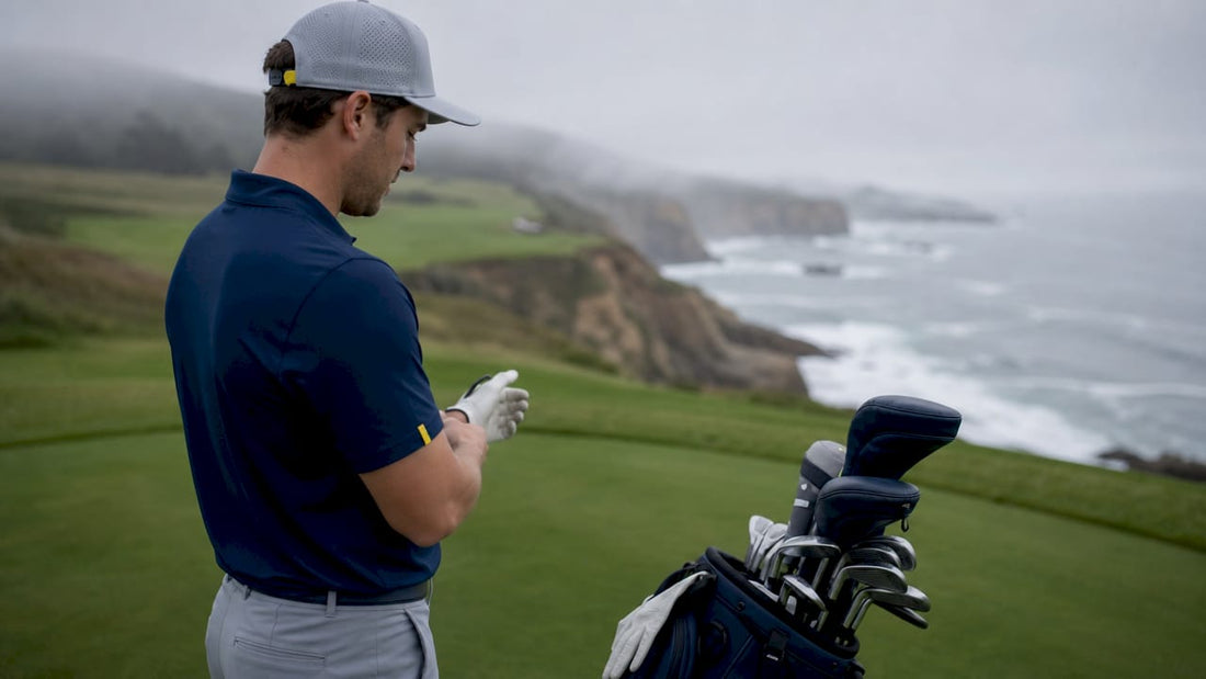 Golfer preparing accessories on golf course tee box